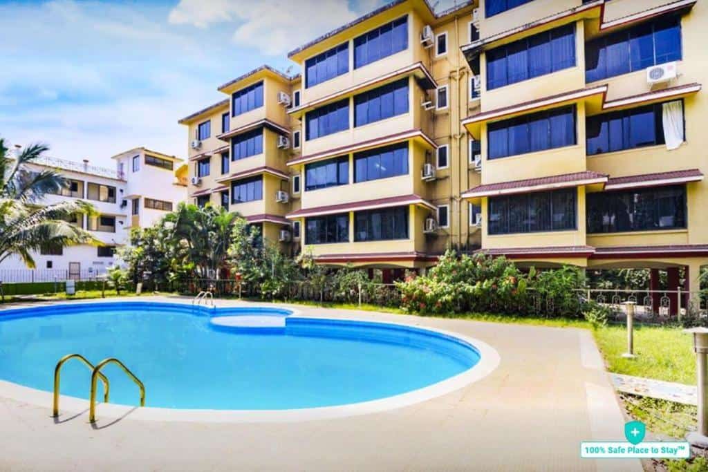 Exterior view with swimming pool at HomePlus Garnet in Vagator